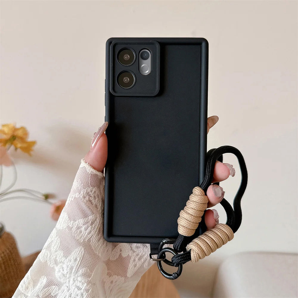 Black phone case with a handle held by a hand against a neutral background